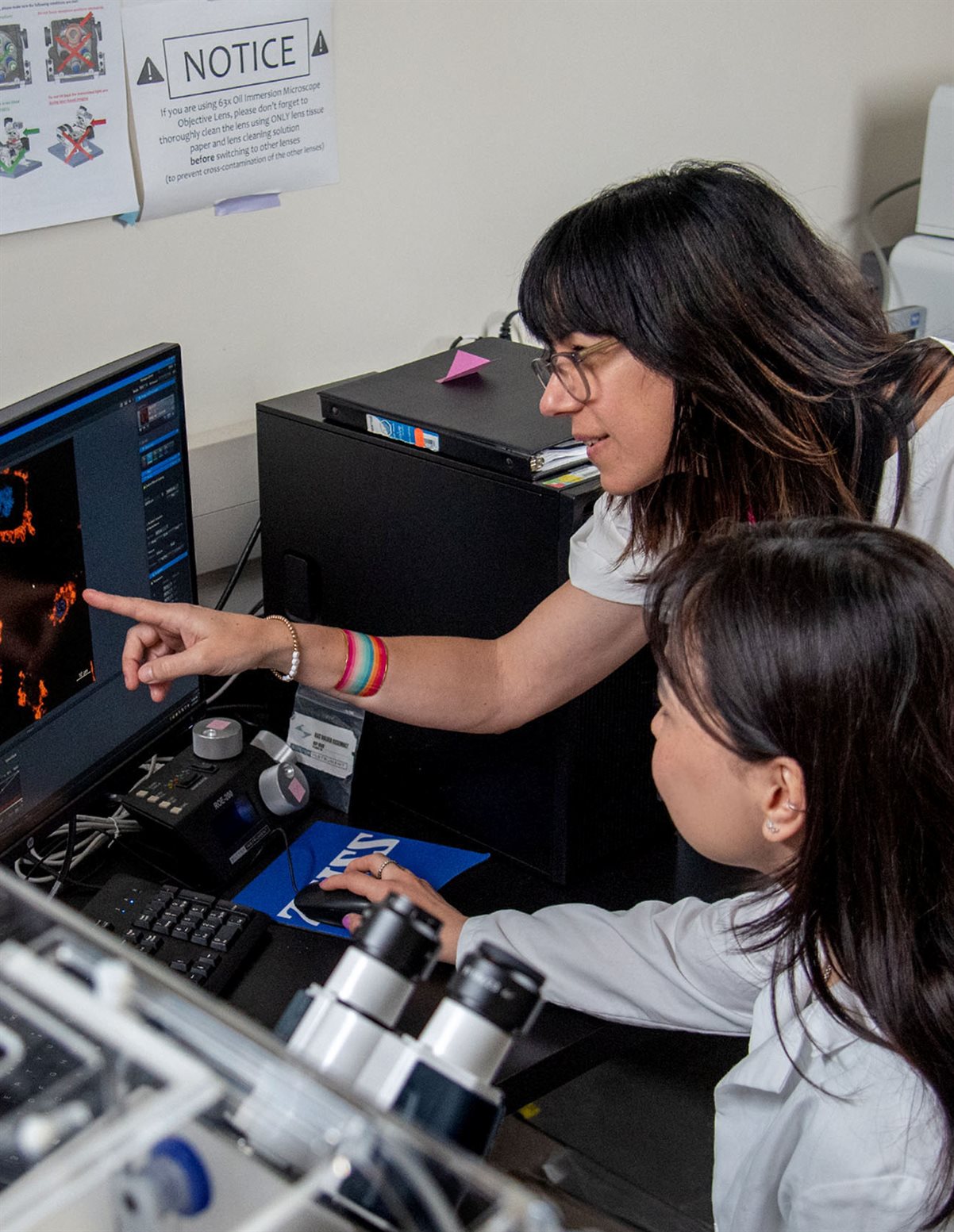 Materials Science and Engineering professor Cecilia Leal works with graduate students in a lab at MSEB in April 2023. Prof. Leal is pictured with graduate student, Nurila Kambar.